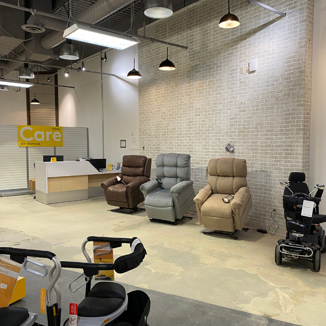 Motion Grande Prairie Showroom Display of Power Lift Recliners with Care Desk in background